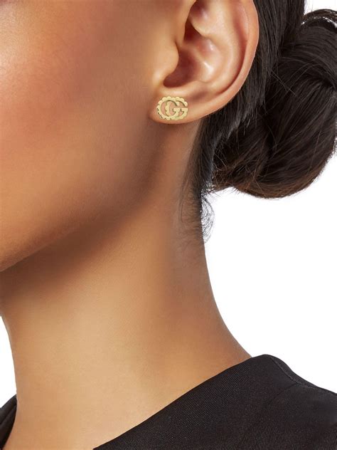 gucci golden ears|Gucci earrings on model.